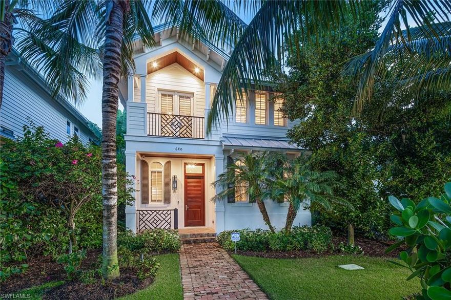 Quintessential coastal cottage in downtown Naples located a very short distance from Fifth Avenue South for shopping, dining and entertainment and only six blocks from the beach. Fabulous two-story single-family home with great room floor plan, featuring four bedrooms and three-and-a-half baths. Open kitchen with quartz countertops, gas Wolf range and Sub-Zero refrigerator, plus breakfast bar, large dining and living space. Adjacent powder room and walk-in pantry plus an elevator. Ten-foot sliding glass doors lead to a covered/screened outdoor living area with a built-in grill overlooking the pool and spa with a water feature, privacy wall and lush landscaping. Second floor features gorgeous primary suite with a large bath and two walk-in closets, and three guest bedrooms with two full baths. Two-car garage located at the rear with alley access. Offered fully furnished — designer details, lighting and furnishings just complete September 2021.