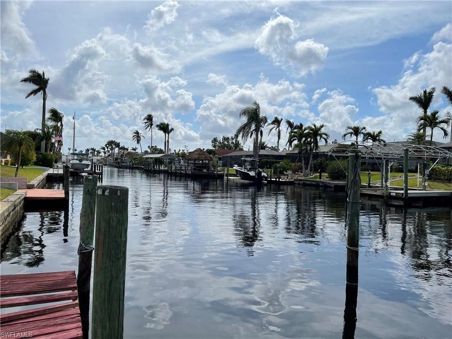 WOW!!!! A BOATER'S DREAM SOUTHERN EXPOSURE WITH NO BRIDGES!!! THIS OVER 2,000 SQ.FT. POOL HOME WITH 3 BEDROOM 2 BATH AND AN OVERSIZED 2 CAR GARAGE HAS BEEN WELL CARED FOR. HOME HAS A FULL HOME GENERATOR AND HURRICANE SHUTTERS AND SHOWS PRIDE IN OWNERSHIP. HOME IS LOCATED IN THE VERY PRESTIGIOUS SAVONA PKWY AREA. DOCK YOUR YACHT AT THE DOCK AND YOU WILL BE ONLY 3 MINUTES FROM THE RIVER IN A PERFECT DIRECT ACCESS SAFE PORT FOR EVEN YOUR 50'+ YACHT AS THE AREA IS VERY WELL PROTECTED. THIS WONDERFUL NEIGHORHOOD IS CENTRALLY LOCATED WITH EASY ACCESS TO ALL POINTS IN THE CAPE AND THE COUNTY. HOME IS SURROUNDED BY MULTI MILLION DOLLAR HOMES WHERE YOU CAN FISH OFF THE DOCK OR SIT WITH A COOL COCKTAIL AND ENJOY LIFE. 
UNFORTUNATELY, HURRICANE IAN LEFT ITS MARK BUT THE HOME IS STANDING TALL AND STRONG. THIS HOME IS SOLD IN THE AS-IS CONDITION. MAKE AN APPOINTMENT TO SEE THIS WATERFRONT DREAM LOCATION AS IT WILL NOT LAST LONG.