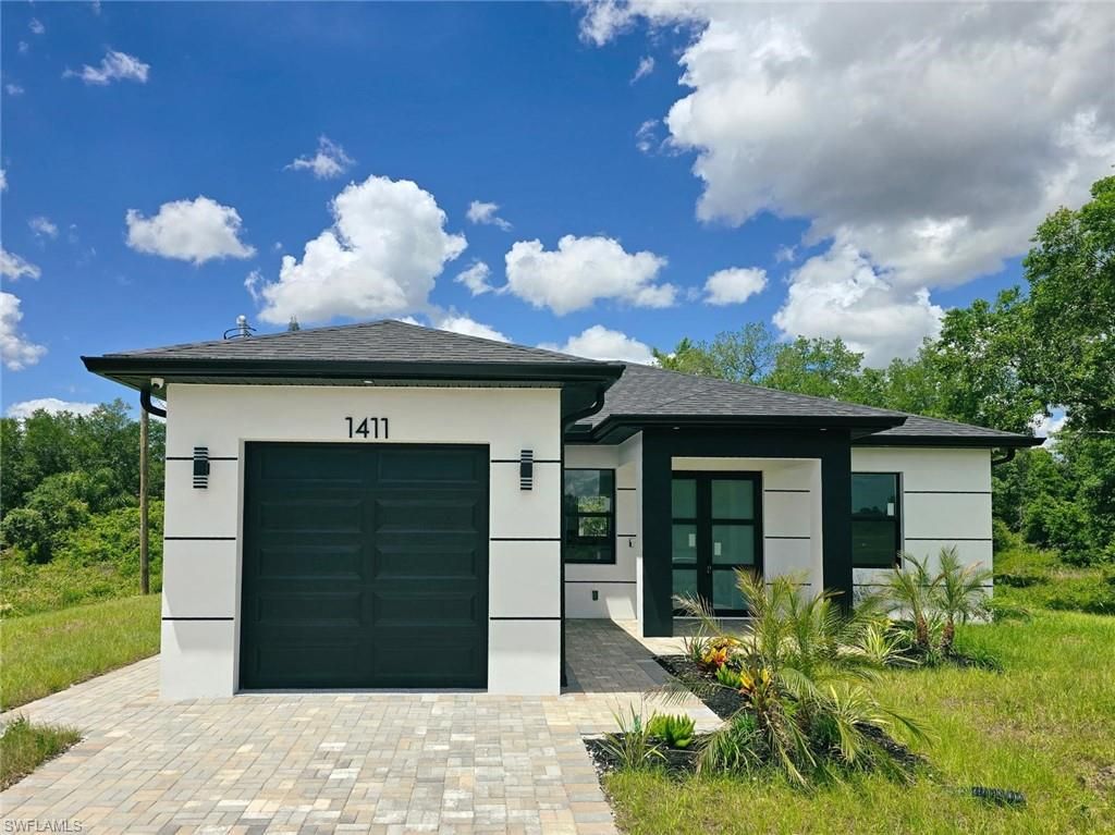 Photo of 1411 Moore AVE, LEHIGH ACRES, FL 33972 (MLS # 226017323)
