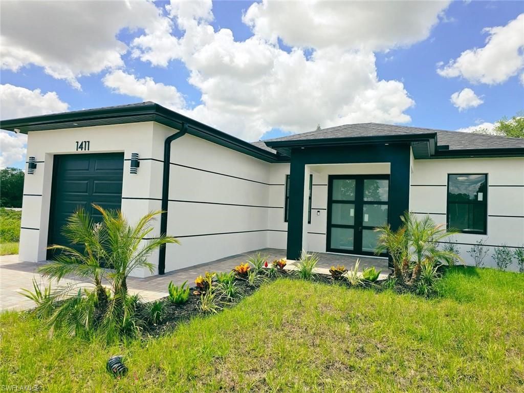 Photo of 1411 Moore AVE, LEHIGH ACRES, FL 33972 (MLS # 226017323)