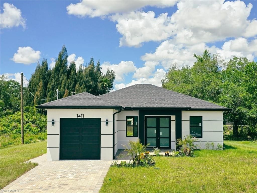 Photo of 1411 Moore AVE, LEHIGH ACRES, FL 33972 (MLS # 226017323)