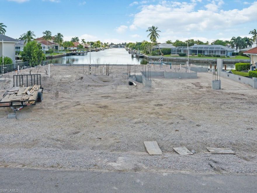 Looking for the perfect coastal living experience? Then this water direct, southwest exposure, custom home to be completed in 2021 is for you! This 2-story home offers 4 bedrooms, 4 full baths (w/ pool bath) & 1 powder bath, study & 3-car garage w/ tandem garage for 4th car. Gourmet kitchen with huge island, custom Amish built cabinetry, beautiful hardwood flooring in main living areas, the luxury master bedroom w/ custom closet & master bathroom w/ rain shower. The 2nd floor guest area has 3 bedrooms, 2 baths, a large family area & balcony overlooking the gorgeous long & wide water views. The family room, den & master BR ceilings are defined by beams over beaded board & crown molding. Outdoor features: spacious living area w/ summer kitchen, dining area, custom stainless gas fireplace, grill, cypress ceiling with roll down screens that all open to an heated pool with shallow wade area and spa. Plus, there is immediate boating access to the open water of the Marco River! The garage has custom extra width doors & there is a tackle/storage room here, too. There is a new seawall! A true masterpiece!! Please note: Photos are of previous home; current home will be almost identical.