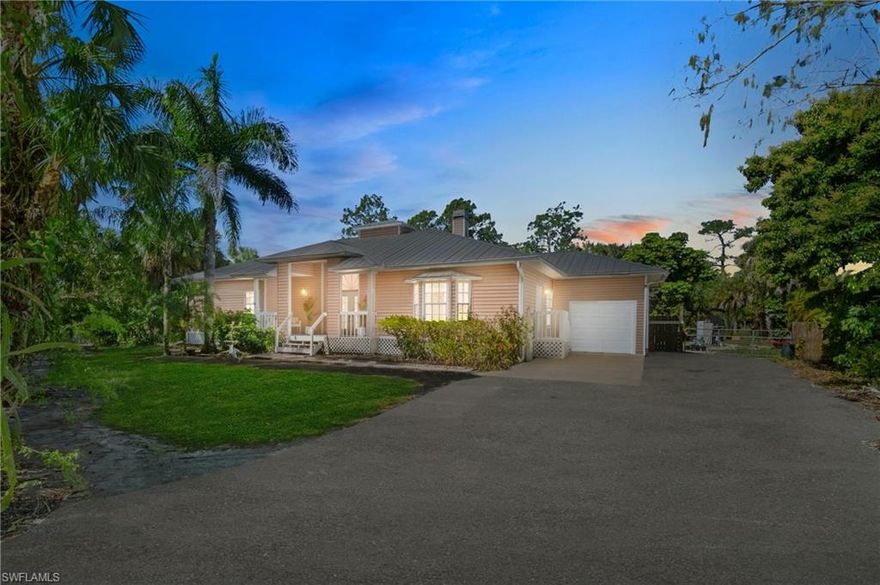 Welcome to your dream Key West-style oasis nestled in the ideal NW Golden Gate Estates location, just a mere 4 minutes from Collier Boulevard and close to all the amenities of town living. Step onto the enormous front porch, reminiscent of Southern charm, and imagine sipping a beverage while enjoying the evening breeze. The expansive rear pool deck of this custom built home beckons you for leisurely afternoons spent lounging in the sun or entertaining guests with its abundant seating area.  Situated on a lush 2.5-acre parcel, fully fenced with newer agricultural fencing, this property is a nature lover's paradise, complete with mature tropical landscaping, a designated goat/small livestock area, and ample space for fruit and vegetable gardening. The north side of the property offers convenient RV and boat parking potential, ensuring all your outdoor recreational needs are met.  The staggered positioning of the main house not only provides a sense of privacy but also allows for a circular drive, enhancing the property's curb appeal. Recent upgrades, including a new stone driveway topper, meticulously manicured landscaping, and fresh exterior trim paint, ensure this home shines from every angle.  Inside, the high volume ceilings in the open great room create an inviting atmosphere, perfect for both relaxation and social gatherings. Oversized bedrooms offer unparalleled comfort and space.  With the assurance that 21st St will remain a dead end, preserving the tranquility of the neighborhood, and only the canal being moved at the north end for the Vanderbilt Extension, this home offers long term privacy and value!  Don't miss the opportunity to make this sanctuary your own. Schedule your showing today and embrace the epitome of Florida living.