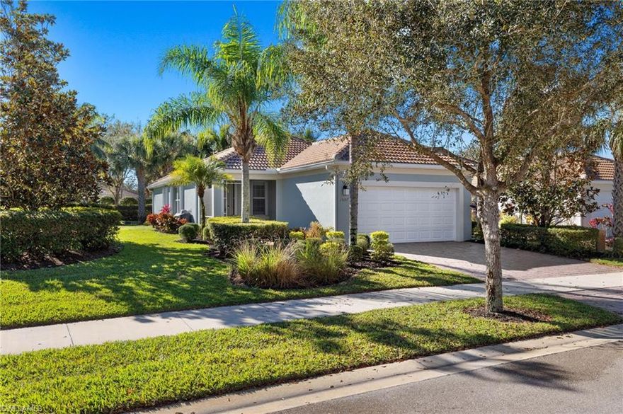 Great opportunity to own this popular “Pine Spring” floor plan which makes a great winter getaway or year-round residence. This home is light and bright w/the raised 9’4” ceiling height upgrade and has 3BR 2 BA 2 car garage. Pleasant interior finishes include plantation shutters, crown molding, 5” base boards and luxury vinyl floors in living areas and tile in baths (easy to clean no carpet). You will love the eat in kitchen with its polished granite, wood cabinets and SS appliances. Master suite is generous in size w/large walk-in closet, slider for easy access to lanai and bath has convenient walk-in shower. This home sits on a pretty landscaped lot and is very private as there is no house on the left side. Hurricane protection is easy w/accordion hurricane shutters on the windows and Kevlar electric shutter on lanai. Reef Lane is a short walk, bike or golf cart ride to the amazing amenity rich town center that offers something for everyone: resort style pool, lap pool, fitness, tennis, bocce, pickleball, restaurant, beauty salon, ice cream shoppe, spa, lifestyle director and so much more. Guard gated, pet friendly and LOW HOA fee. This home is a must see!