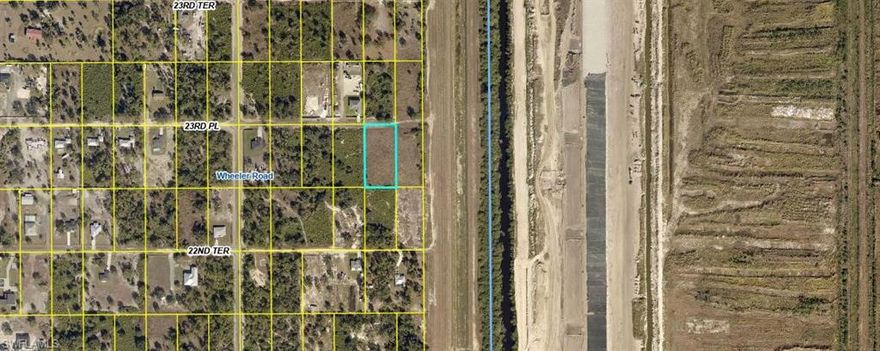 Discover the freedom and potential of rural Florida living with this 1.25-acre residential parcel located in the peaceful Wheeler area of LaBelle (Central Hendry County). Zoned RR-WE (Rural Residential), this vacant lot offers the perfect opportunity to build your custom single-family home with room to spread out and enjoy wide-open space.

Measuring approximately 165 feet wide by 330 feet deep (54,450 square feet), this standard 1.25-acre parcel provides ample room for a primary residence, detached garage, workshop, garden, or outdoor living space. The property is mostly wooded, giving you a natural backdrop and added privacy while still allowing you to selectively clear to suit your vision.

Located on a county-maintained public dirt road (23rd Place), the property offers legal access while maintaining the quiet charm of country living. No HOA. No deed restrictions. No architectural review board. Bring your builder and design the lifestyle you want without the constraints of a subdivision.

This property is not located within a platted development, giving it a true rural acreage feel. Zoning allows for single-family residential use, and the area is ideal for those seeking space, privacy, and flexibility. Well and septic will be required, as is typical for rural Hendry County properties.

Enjoy the benefits of being away from the congestion while still within reasonable driving distance to LaBelle, Clewiston, and Fort Myers. Whether you are looking to build now or invest for the future, this parcel presents an excellent opportunity in a growing area of Southwest Florida.

If you’ve been searching for affordable acreage with room to breathe, this is your chance to secure 1.25 acres in Central Hendry County and create your own private Florida retreat.
