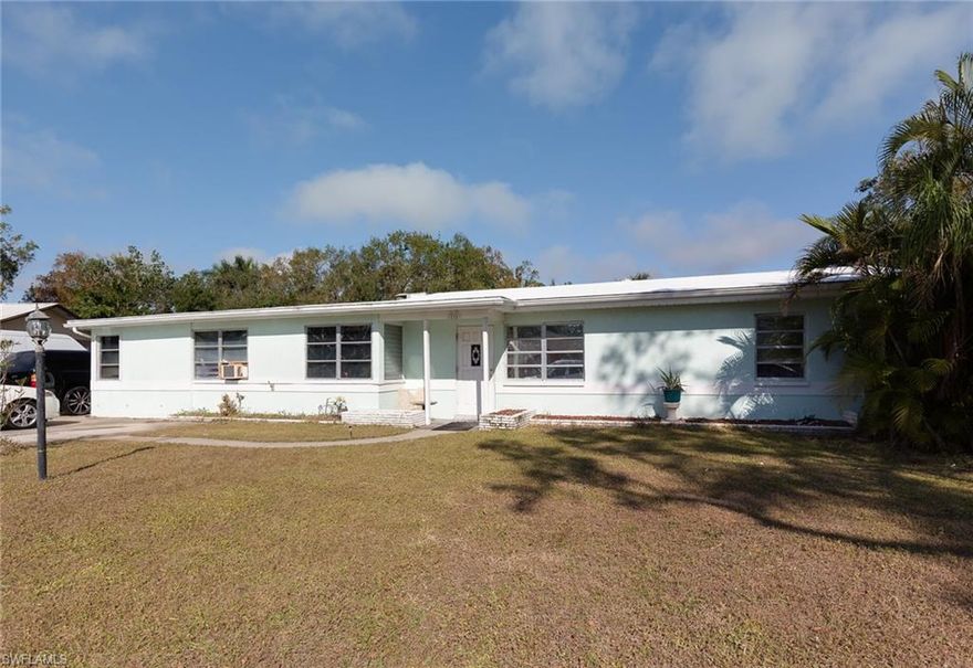 INVESTMENT OPPORTUNITY!  Gulf access home in North Fort Myers with 10 year tenant who would like to stay! This 3/2 home offers separate entrance to complete suite:  bedroom, full bath, living room, full kitchen, pantry and utility room.  Main house features formal living and dining areas, eat-in kitchen, 2 bedrooms, full bath and screened lanai. Large backyard with storage shed overlooks wooden dock that can accommodate up to 25' boat; located on gulf access canal to Caloosahatchee River via Powell Creek.  Other features include large windows, freshly recoated polyurethane roof, wood cabinetry and tile backsplash in kitchen, large concrete area adjacent to screened lanai; all this on a quiet street in well-established neighborhood.  Home needs work & updating but the tenant is fine with everything and will gladly stay on.  Rental rate etc. available upon request.  Where else can you find gulf access for this price??  Sold "AS IS".  This versatile property could be an excellent investment in Lee County's active waterfront market.