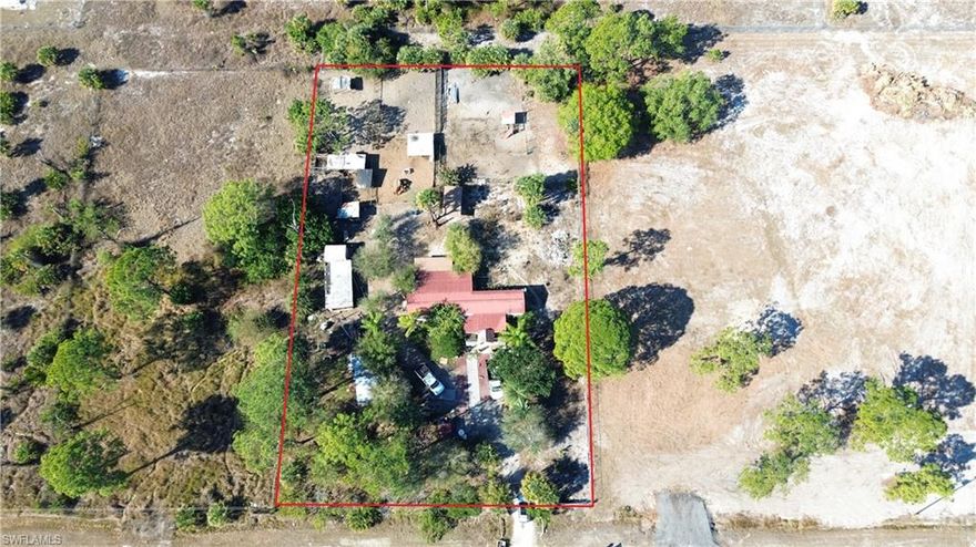 Affordable home in Montura Ranch Estates with tlc needed. Property sits on 1.25 acres fenced in located on the south end of this rural golf-cart and horse-friendly community. 4-bedrooms and 2-bathroom SW with additions, metal roof. Home has chicken coops and a horse corral. Animals can be bought separately or make a deal. Cash offers only. Call and make a deal, schedule your showing today. 1.5 hr from each coast. No city taxes or HOAs paid. This community offers clubhouse and poolhouse free to residents.