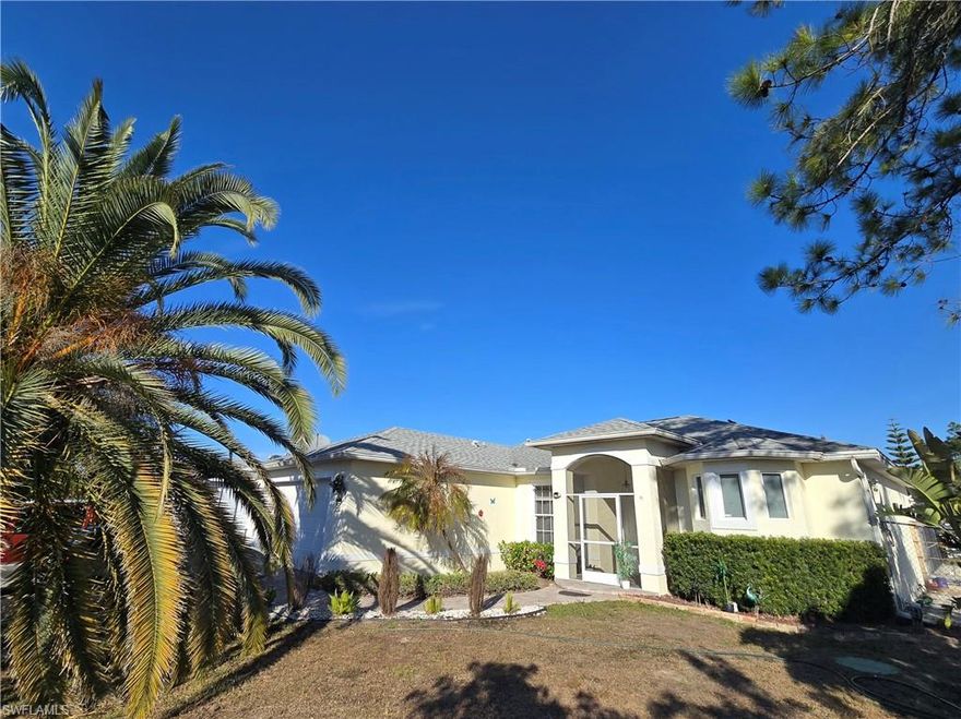 Priced to Sell "Your PERFECT 3 Bedroom and 3 Bathroom Home!" yes, a 3/3, A real "Paradise" A Home that comes on a huge wooded 1/2 Acre Lot. With screened Pool lanai area and Solar panels that keep your pool under controlled temperature, this Home is where you can move right in and have Everything you want . Great News .. You have just found it! This highly Customized Home features 10' ceilings that soar over the imported Travertine Marble floors. It's filled with very high end details like 8' Doors, Custom Lighting, Niches & Arches. Large open Kitchen with custom Cabinets, Granite Counters, Stone Backsplash and Stainless Appliances. Each of the 3 spacious Bedrooms come with their very own individual custom Bathroom featuring stylish vessel sinks on marble counters, custom glass shower doors & classy tile work. The private Master Suite features Sliders to the Lanai and big walk in Closets.  Huge Lanai and Saltwater system Pool with maximum Paver space over looking the Super Private Mega Backyard with fruit trees