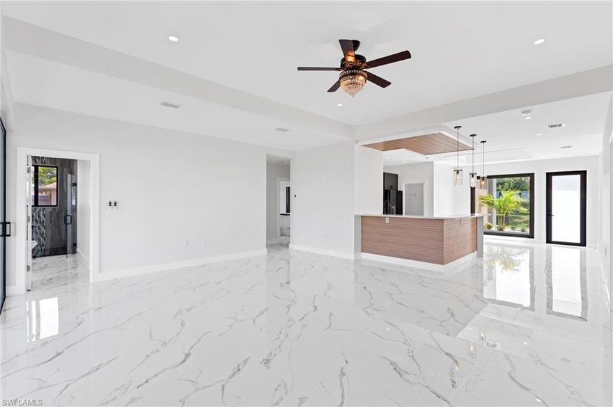 Welcome to this stunning new construction residence located in one of Northeast Cape Coral’s most desirable neighborhoods, situated in a NO FLOOD ZONE and built with hurricane-resistant features. This beautifully designed home offers 3 spacious bedrooms + den/bonus room, 3 full bathrooms, and a 2-car garage, all thoughtfully arranged for comfortable Florida living.
Step inside to a bright, open floor plan accented with tile flooring throughout, sleek granite countertops, and modern black appliances, creating a stylish and functional kitchen perfect for everyday living and entertaining. The versatile den provides additional living space ideal for a home office, media room, or fourth bedroom option.
Natural light fills the interior, highlighting quality finishes and impressive structural integrity designed to withstand severe weather. Outside, enjoy your private yard with room for a pool, perfect for relaxing or hosting guests under the Florida sun.
Additional features include:
Expansive windows framing peaceful views and flooding the home with sunshine
Concrete block construction with flat roof engineered for durability
Central heating and cooling system
Septic and well utilities, no community HOA
Garden views and outdoor patio area
Option for seller-paid concessions toward interest rate buy-down or closing costs (based on offer)
This exceptional property combines energy-efficient design, modern amenities, and superior safety features — a rare opportunity to own a quality built home in Cape Coral.