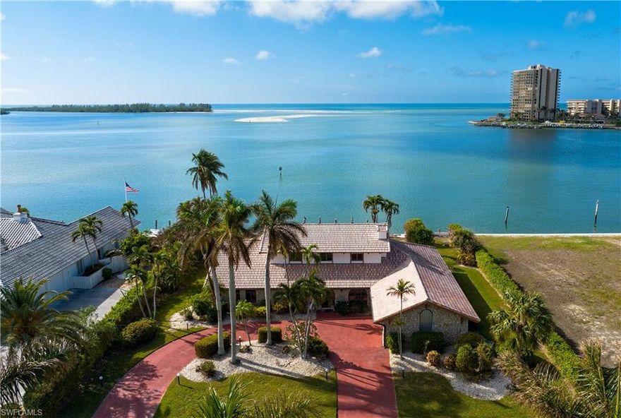 A rare opportunity to build your dream Gulf front home or enjoy living in the existing home which offers incredible views of the Gulf of Mexico. This property is located in one of the most luxurious locations on Marco Island. Take advantage of this opportunity to invest and live in the Marco Island Estates on prestigious Caxambas Island. Surrounded by mansions, this Estate size lot offers 125 feet of Gulf frontage. Bring your boat or yacht, enjoy the large in-ground pool, outdoor patio/lanai area while taking in the all day sunshine with southern exposure. You can relax and watch the dolphins swim by your home, and enjoy stunning nature views and gorgeous sunsets. The home features a split floor plan with 6 Bedrooms and 5 Baths. First floor primary bedroom, two kitchens, two fireplaces, and two living room areas, great for hosting and entertaining guests. Large circular driveway when entering the property. With a little updating this property will be a home for a lifetime. Quick deep water direct Gulf front access with long and wide water views of Caxambas Pass and the Gulf of Mexico. Don't miss out on the potential this property and location offers on beautiful Marco Island.