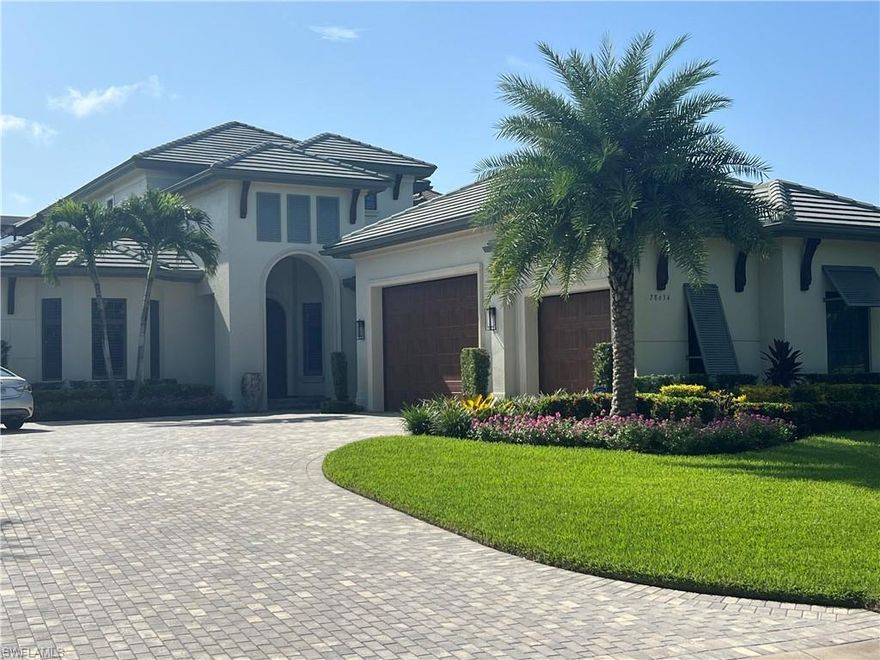 Uniquely beautiful, this home features 2 Primary Suites and is prominently located in La Caille of Quail West, an exceptional McGarvey custom home featuring an open floor plan with gracious stairs to the second level.  The private elevator provides convenience, and you will have stunning views withs a SE exposure over the lake and golf course. The masterful kitchen has a food prep island and breakfast bar, fine appliances including gas range and a pantry.  With the wet bar, wine room and whole house generator, you are going to bask in the glory of SWFL living. The lanai is a tropical oasis, with loads of covered seating area featuring a wooded ceiling, outdoor fireplace and an outdoor kitchen all overlooking the heated pool and spa! 4- car garage easily accommodates your vehicles and Florida toys!