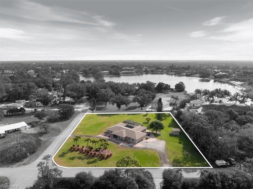 Photo of 50 Cajeput DR, NAPLES, FL 34108 (MLS # 226013162)