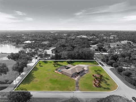 Photo of 50 Cajeput DR, NAPLES, FL 34108 (MLS # 226013162)