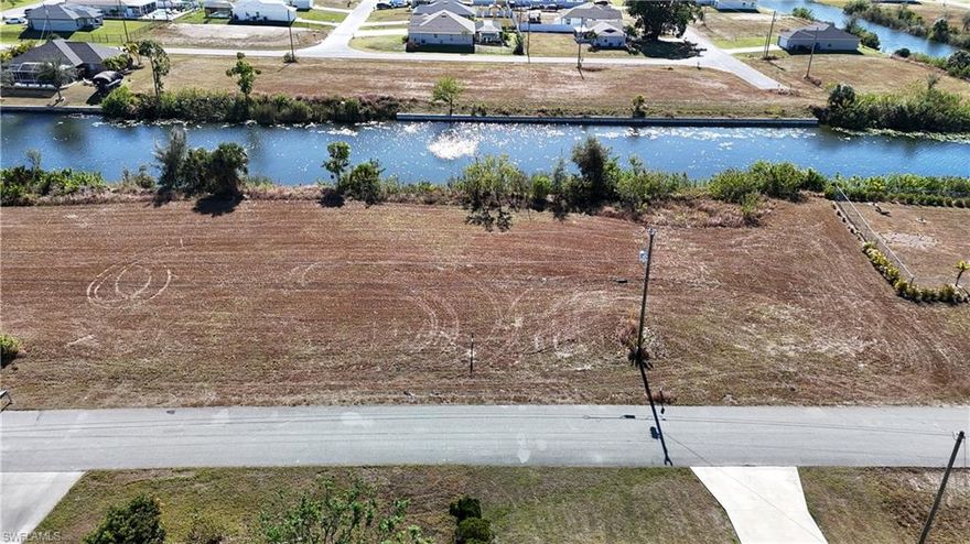 Get your little piece of paradise before its too late. Discover your opportunity to own a prime piece of land in the heart of Cape Coral! This vacant lot is ideally located in a highly desirable area, perfect for building your dream home or investment property. Cape Coral is known for its booming growth and high-quality lifestyle. Whether you’re looking to build your forever home or secure a piece of Florida real estate, this property is an excellent investment.