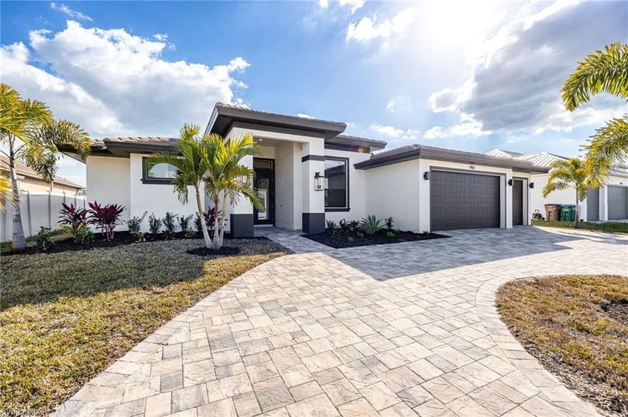 Welcome to a stunning new construction home perfectly positioned in the heart of Southwest Cape Coral, just minutes from Cape Harbor, Tarpon Point, waterfront dining, boutique shopping, and everything that makes this area one of the most desirable boating communities in Southwest Florida.
From the moment you arrive, the circular driveway and spacious three-car garage set the tone. Step through the front door into a light-filled foyer that opens to an expansive family room with pocket sliders, creating a seamless transition between indoor and outdoor living. This is true Florida living. Imagine cozy evenings by the fireplace, then opening the sliders to let in the breeze and the peaceful water views.

The open floor plan was designed for both everyday comfort and unforgettable entertaining. The kitchen is the showpiece, featuring a massive island, custom shelving, sleek finishes, and effortless flow into the dining and living areas. It’s the kind of space where everyone gathers.

The primary suite is a retreat of its own, complete with sliders leading directly to the pool area, custom lighting, and generous closet space. The spa-inspired primary bath feels like something out of a luxury magazine, offering a soaking tub, oversized walk-in shower, and the space you’ve been dreaming about.

Guest bedrooms are generously sized, with one offering convenient access to the pool bath, perfect for hosting friends and family.

And then… the outdoor living. This is where the magic happens. A custom pool and spa overlook a wide canal, creating a breathtaking backdrop for sunset evenings. The expansive lanai and outdoor kitchen make entertaining effortless. With great Gulf access and only one bridge out to open water, your boating days are just minutes away. Design your dock to fit your lifestyle and even add a tiki hut to truly embrace that Southwest Florida vibe.

Additional features include hurricane impact windows and doors, tile throughout, luxury finishes, and thoughtful design at every turn.

This home was built for making memories. If you’ve been waiting for a new construction Gulf access home in SW Cape Coral that checks every box, this is it. Come experience it in person and see why this one feels different.