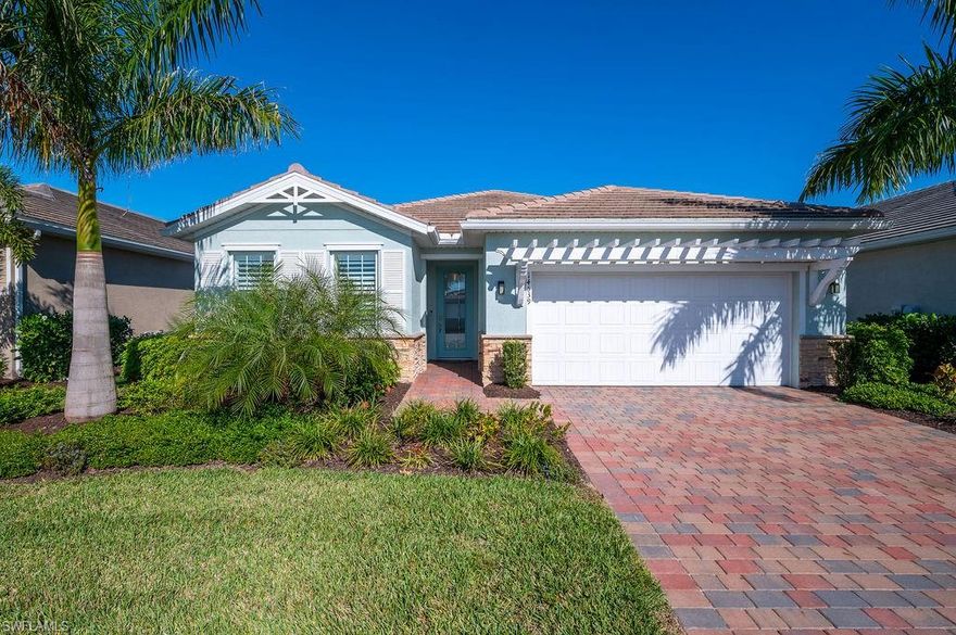 Naples Reserve with beautiful lake and preserve views! This 4 bedroom, 2 bath home is offered Turnkey Furnished and move in ready! Meticulously maintained with with beautiful wood look flooring throughout the entry, main living area, primary bedroom and guest bedroom, with only carpet in the 2 front guest bedrooms! Gorgeous white kitchen with SS appliances and large island. Stunning pool with sun shelf and spa overlooking a large lake with private views in the distance! Enjoy the outdoor kitchen and large covered area to include electric hurricane screens! Naples Reserve has wonderful amenities surrounded by a large lake with electric boating options, resort style pool, fitness, tennis, pickle ball, dog park and delicious cafe!