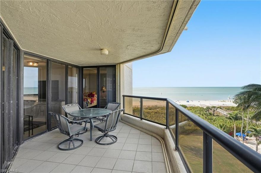 Enjoy sweeping water and beach views from this 5th-floor end-unit with one garage parking space and private gated access just steps to Marco Island’s iconic white-sand beaches. 

This TURNKEY furnished 2-bedroom, 2-bath residence offers abundant natural light, a desirable split-bedroom layout, and thoughtful interior features designed for comfort and convenience. The primary suite overlooks Marco Island, while the guest bedroom enjoys beautiful beach and Gulf views.

The interior includes a wet bar, in-unit washer and dryer, and an open living area that functions as a true home away from home for both owners and guests. A spacious wraparound balcony offers wide coastal and island views, perfect for enjoying morning coffee and evening sunsets. 4x4 storage area & 1 assigned garage parking space.

Community amenities include DIRECT secured private beach access, a pool, tennis and pickleball courts, on-site staff, and accordion hurricane shutters on the balcony, which allows for easy lock-and-leave living. Ideal as a low-maintenance second home with quick beach access and the timeless appeal Marco Island is known for.
