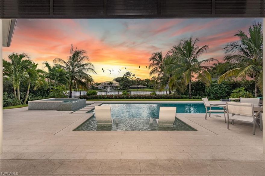 4839 West Blvd is a gem in Park Shore with features that simply can't be added to other homes like X flood zone, a natural gas line and the serene lake view. This home was built by Borelli Construction of Naples with top of the line features: whole house generator, Crestron home & lighting automation, Miele & SubZero appliances, stealth speakers & surround sound system in the great room. The dining room includes a large wet bar with a SubZero wine & beverage fridge. The covered lanai has electric screens & storm shutters to protect the outdoor kitchen & fireplace. Lots of custom built-ins throughout like a mud area and desk off garage, shelving and desk in the office. Legno Bastone wood flooring runs throughout along with marble in the bathrooms. The garage is air-conditioned and has extra space for a golf cart or exercise equipment. The home is setback on the oversized lot to allow plenty of room for more parking. The home overlooks the spring-fed Devils Lake and with its southwestern exposure it offers beautiful sunsets. The large pool has an attached sun-shelf and spa. Beyond the pool there is a great space for pets or children to play and is fenced from the lake.