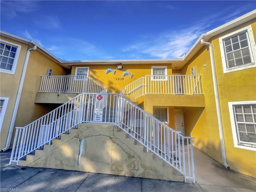 Cape Coral Living Done Right – 2 Beds, 2 Baths, 2nd Floor Perfection

Welcome to the legendary Unit #6 at 1239 Southeast 8th Street, where your future self is already happier, more organized, and somehow always has clean laundry (yes, we’ll get to that).

Perched proudly on the second floor, which is universally agreed upon as the elite level of living (no upstairs neighbors tap dancing at midnight, no ground-floor surprise visits from every bug in Florida), this 2-bedroom, 2-bathroom gem is ready to upgrade your lifestyle immediately.

Step inside and you’ll find a layout that just makes sense. Two bedrooms means options: sleep like royalty, host guests, create a home office, or finally start that “I’ll get into yoga someday” room. Two bathrooms means no more scheduling negotiations or awkward hallway standoffs. Civilization at last.

Now let’s talk about one of the most underrated luxuries in modern living:
Washer and dryer hookups!! That’s right!!! you’re one step away from saying goodbye to laundromats, coin hunts, and that one machine that always smells suspicious. Laundry on your schedule, in your space, like a true adult who has their life together (or at least appears to).

And the location? This is where things get even better.

You’re in Cape Coral, which means:
- Quick access to shopping at nearby spots like Coralwood Shopping Center and Publix at Hancock Bridge Parkway for everything from essentials to “I didn’t need this but I deserve it”
- Nearby dining options including local favorites! ranging from quick bites to “let’s pretend we’re fancy tonight”
- Easy routes via Del Prado Blvd and Pine Island Road for commuting, errands, and spontaneous “I need to get out of the house” drives
- Parks and outdoor spots like Four Freedoms Park and Saratoga Lake Park—perfect for fresh air, sunshine, and reminding yourself why Florida living hits different

This isn’t just a place to live, it’s a place where: Your mornings feel smoother, your evenings feel calmer, and your weekends feel like they actually belong to you

Unit #6 isn’t trying to be flashy. It doesn’t need to. It’s practical, comfortable, and quietly delivers everything you actually want in a home, with just enough charm to make you smile when you walk in.

Fair warning: once you see it, you’re going to start mentally moving your furniture in.

And honestly? That’s how you know it’s the one.

Utilities: Tenant is responsible for all utilities. Lawn Care included.
Pet Policy: We warmly welcome your furry companions, with the exception of aggressive or dangerous dog breeds.