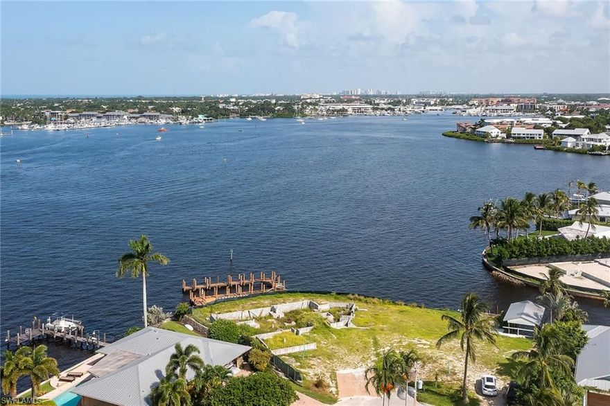 Auction without reserve to be held on-site, Saturday, March 5, 2022, at 11:00 AM. Private appointments are available; call for details.
The most beautiful lot in all of Royal Harbor. Ready for you to build your dream home. Enjoy spectacular western sunset views over Naples Bay every evening. If you are looking for a place for your boat, look no further. This property offers over 120 feet of seawall. There is no other lot that compares.