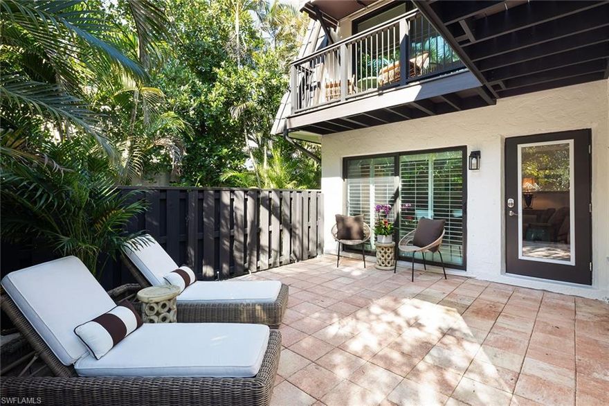 Perfectly positioned just blocks from the boutiques, dining, and coastal energy of 3rd Avenue South, and within easy walking distance to the beach, this charming two-bedroom, two-bath villa offers the ideal blend of walkable lifestyle and private outdoor living. The open-concept living and dining area flows seamlessly into the kitchen with convenient counter seating, making it perfect for casual mornings or entertaining guests. Enjoy multiple outdoor spaces designed for Florida living, including a spacious ground-level patio ideal for gatherings and a generous upper balcony accessible from both bedrooms, creating a peaceful retreat for morning coffee or evening relaxation. The community enhances the lifestyle with a resort-style pool and a shared pavilion featuring grilling areas - ideal for relaxed afternoons and social gatherings. Additional highlights include two assigned parking spaces.  No interior flooding during Ian.