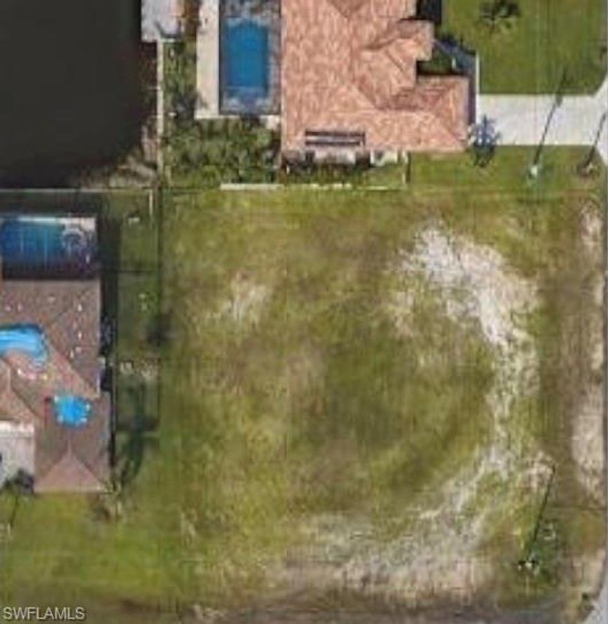 Located at 2103 SW 4th St, Cape Coral, FL 33991, this oversized 0.36-acre corner lot presents a rare opportunity to build a custom masterpiece in a rapidly growing area of Southwest Cape Coral. Comprised of three combined lots, this expansive property boasts an impressive 120 feet of frontage, offering immense flexibility for architectural design and added privacy. The site features a serene lake view that perfectly captures the Florida lifestyle, while its RD-D zoning and access to a paved road with central utilities make it prime for development. Residents will enjoy proximity to top local attractions, including the family-friendly Fellowship Park, Gator Mike’s Family Fun Park, and Sun Splash Family Waterpark. This is a standout opportunity to secure a large parcel with beautiful water views in a neighborhood transitioning with new construction and modern amenities.