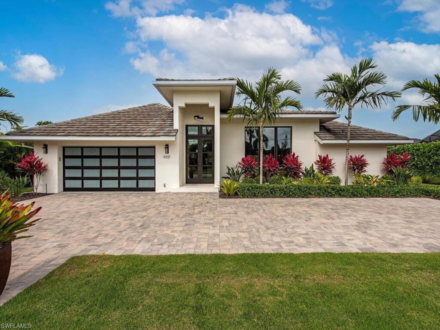 H5443 - Luxury and location await you in this fully renovated and turnkey furnished home. With volume ceilings, remote blinds, wide plank wood floors, custom lighting, impact windows, and doors. A state-of-the-art kitchen with wolf and subzero appliances, custom cabinets, open shelves, and an oversized center island is excellent for gathering or meal prepping. The primary suite is secluded with access to the under roof patio for ultimate privacy. The second bedroom offers a private ensuite and dual access to the beautiful backyard space The third and fourth bedrooms are tucked away in the rear of the home for a quite relaxing retreat. A new pool heater, A/C Garage, oversized laundry room, fenced yard, and upgraded landscaping are just a few added features. Located one block from the park, or a short walk to the waterside shops it is the perfect location for the SW Florida lifestyle. Park Shore has a voluntary HOA - with private beach access.