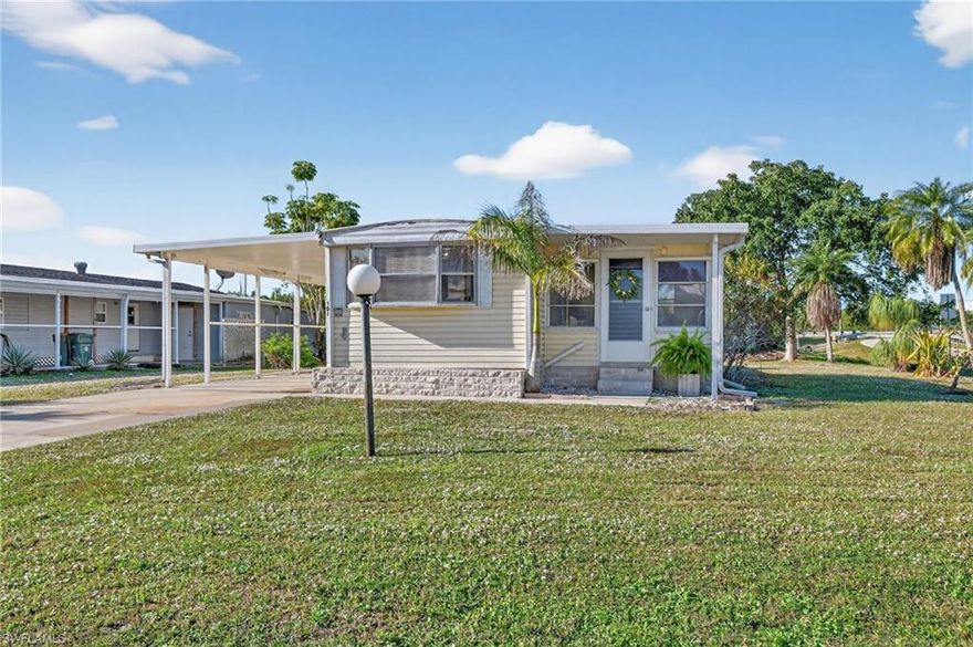 Desirable Riverwood Estates is a charming 55+ boating Community, located between Marco Island and Naples. You own the land! Community HOA fees only $235 per year. Pet owners can enjoy their furry friends with appropriate limits & approval. Additionally, residents have the added benefit of a boat ramp for boating and kayaking, offering access to the Gulf of Mexico. This residence is the lowest priced home in Riverwood and  is situated close to the ramp and fishing dock. Built in 1973, this residence boasts 2 bedrooms, 2 bathrooms, plus an enclosed Lanai, giving the home more living space. New closet doors, new refrigerator and stove. Plus, a storage shed for shutters and the washer and dryer.   Comes partially furnished, sold as shown.  Laminate wood floors throughout. The home sits on a large corner lot -0.19 acre. Just minutes from shopping, dining and the magnificent beaches of Marco Island and Naples.