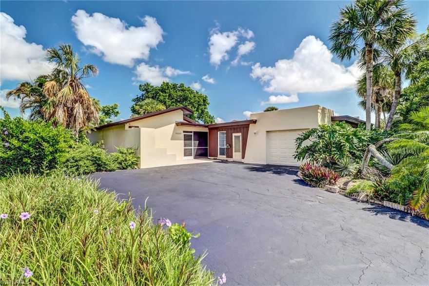 E-Z-2-C! And ready for immediate occupancy!  Nearly completely remodeled - almost like new!  Light, bright and neutral backgrounds, you'll want to see this one first!  Across the street from the golf course, this Lakewood villa (HOA) is located ten minutes from Olde Naples and the sandy beach on the Gulf of Mexico.  Enjoy Naples weather, dining, shopping and entertainment at a great price.  New kitchen cabinets and countertops, new ceramic tile floor, new bathroom fixtures, new light fixtures and ceiling fans and move-in ready! Glass enclosed lanai makes a perfect den or Florida room.  Includes a garage and a lushly landscaped lawn.  Low annual fees make this appealing to investors too!  Separate memberships available at Lakewood Country Club of Naples for golf, tennis, pool and social activities. Call now to schedule a private showing!!