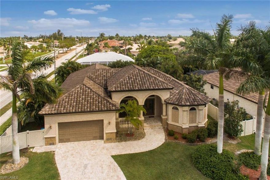 NOTICE OF MULTIPLE OFFERS, DEADLINE 6PM 03/08/2021. Your search is over! THIS IS IT! Location, quality &  design. Desirable SW Cape location, custom design w/open concept w/2, 90 DEGREE tall sets of sliding glass doors to view the incredible oversized screened pool & entertainment area. Beautiful caramel TRAVERTINE marble floors thrUOUT create a continuous flow right out to pool w/waterfall detail, built in table & sun shelf. The double French door entry creates that wow factor w/12' recessed CYPRESS ceilings & crown molding. The large GOURMET kitchen is the heart of the home w/self closing Maple cabinets, large prepping granite island, a raised bar to seat all of your guests & Stainless appliances, including newer Samsung SMART refrigerator & farm house COPPER sink. The chef designed outdoor kitchen has everything you've dreamed of: a Guinness KEGERATOR, wet sink, electric wifi enabled slide out SMOKER, 100 can bev cooler, Bullitt stainless grill, custom stone work & granite counters. A spacious master features a huge spa like bath with walk thru shower, separate tub + dual vanities. Each guest suite has it own marble & granite bath too.