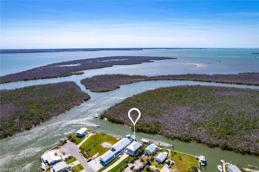 This exceptional, like-new ICF construction pool home, built in 2021, offers unparalleled direct Gulf access and exceptional durability. For extra peace of mind, the owners just added flood gates!! Designed with Insulated Concrete Forms reinforced with steel and filled with concrete, it provides superior strength and energy efficiency. Offered Turnkey with some exceptions. Step into a foyer straight out of HGTV. The elevator ensures effortless access, making this the perfect forever home. Embrace the island lifestyle with an incredible downstairs bar and outdoor entertainment area, complete with a sparkling pool and a boat dock featuring a covered lift. The serene rear view offers total privacy, overlooking a pristine preserve teeming with wildlife. Whether you’re setting sail for Sanibel Island or fishing right from your dock, this dream home delivers the ultimate waterfront experience. The owners love this laid-back neighborhood so much they are building a new home just a few doors down. Come see for yourself!