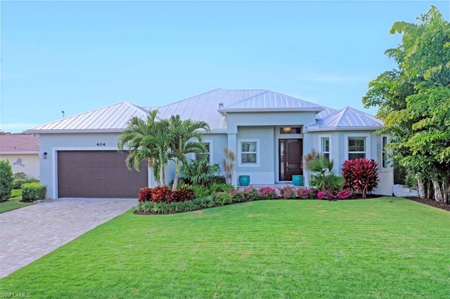 Beautiful coastal custom home with direct quick access to the Gulf of Mexico. Mature lush private tropical landscaping with a Zoysia Grass, professionally installed by Squares Landscape Co.  This home has a 25 x 25 great room with 12' volume ceilings. Open concept 15 x 20 kitchen with gorgeous white cabinets, 8 x 5 Pompeii Quartz Island and countertops, stainless steel appliances and stainless steel Farmhouse sink, 62" wooden Prop ceiling fan, 3 oversized bedrooms, Impact glass 8' sliders and windows. Florida style metal roof. Paved brick driveway, two car garage with ample storage. Almost 800 Sq. Ft of paved lanai with inviting 28 x 14 pool with electric heat and wonderful sunsets views in the evening.  Custom 40 x 15 boat dock with Aztec decking, totaling 377 Sq.Ft.  10,000 Lb. Neptune lift.  New Rip Rap embankment. Hoot System in place. Agent is related to seller.