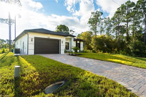 Photo of 327 Lownde AVE S, LEHIGH ACRES, FL 33974 (MLS # 226032777)