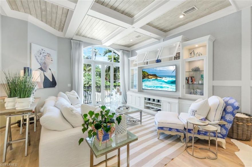 Indulge in the pinnacle of coastal luxury at Villas Tivoli—an extraordinary residence in the heart of Olde Naples where refined design meets effortless elegance. Showcasing over $800,000 in curated enhancements, this impeccably reimagined 3-bedroom plus den, 2.5-bath home offers nearly 2,000 square feet of sophisticated living space.

Every detail has been masterfully crafted, from the striking natural stone accent walls lining the hallways to the plantation shutters and elevated designer finishes throughout. Light-filled and beautifully appointed, the open-concept layout creates a seamless flow ideal for both relaxed living and upscale entertaining.

At the heart of the home, the designer kitchen is a true showpiece, featuring a farmhouse sink, sleek custom cabinetry, and premium appliances—all opening effortlessly into the spacious living and dining areas.

Step outside to your private pool—an inviting retreat for serene mornings or sunset gatherings. A balcony just off the main living area provides a tranquil vantage point to enjoy the coastal breeze. The versatile den offers the perfect space for a home office or media lounge, while a one-car garage and paved driveway add both convenience and style.

Ideally located just five blocks from the vibrant energy of 5th Avenue South, Villas Tivoli places you moments from world-class dining, boutique shopping, art galleries, and the pristine Gulf beaches. Whether as a seasonal escape or a full-time residence, this home embodies the ultimate Naples lifestyle—luxurious, walkable, and effortlessly refined.