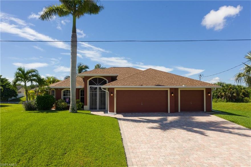 This is the waterfront home in Paradise you have been looking for! On a freshwater canal that has access to miles of connected canals and 5 lakes. The dock is ready for your boat so you can cruise the canals and fish to your hearts content. Lots of storage with a 3-car garage. All tile inside and a wall of slider doors in the great room to bring the outside in. Granite counter tops and a large island in the kitchen, new stainless stove and dishwasher make cooking and clean up a breeze! Master bedroom has a lighted tray ceiling and French doors to the lanai. Relax in the master bath soaking tub and enjoy the new glass shower surround. His and her closets and double sinks complete the spa feel. Den has a closet so make it a 4th bedroom. The split floorplan provides lots of privacy when you have visitors. One of the guest bedrooms also has French doors out to the lanai.Great grilling space with a pergola for shade. The paver lanai, back patio and walkway to the dock really make the backyard complete AND there is room for a pool! NEW ROOF December 2019! Grab some delicious mangos from the mature tree in the yard to complete the tropical experience…this one won’t last long!