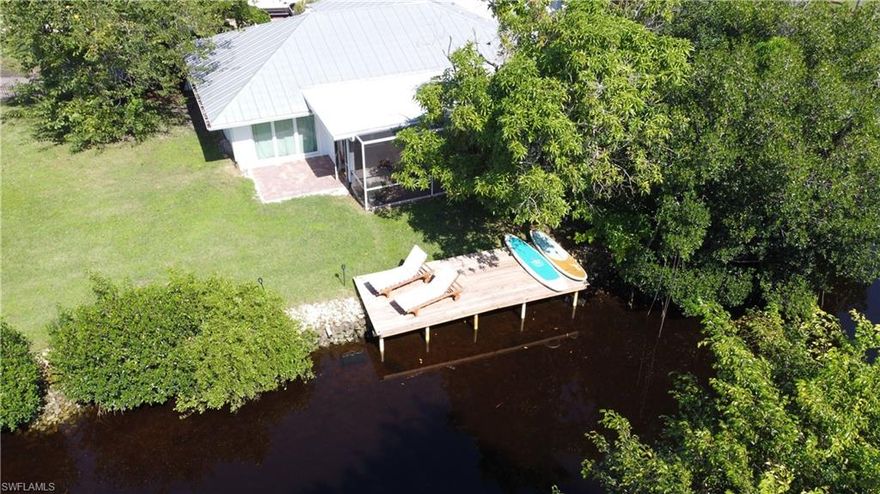 No HOA. Private Gated Boat Ramp - Two docks - Newly Renovated in 2020 - Hurricane Impact windows and doors - Property is fenced on a cul de sac with No HOA - Only property on the street with a boat ramp - 20-25 mins to open water by boat - 5 minute drive to the beach - Selling fully furnished and move in ready. Rental projection for this home is $60,000 a year through Florida Charms Vacation Rentals. Jan, Feb and March 2020 this home was rented for $35,000. Welcome to CHATEAU BONITA! Modern elements throughout this newly renovated home showcase the elegance. Home includes custom real wood cabinets, wood-tile floors, shiplap walls, waterfall island in the kitchen, walk in showers, large soaking tub in the master bath and an outdoor tub, perfect for relaxation and retreat! All bedrooms have stacking glass doors, open up your master retreat & guest suites to let the cool breeze in. During low tide it’s about 2 feet deep. I have a 21ft center console and I can take it out anytime. You can add a boat lift and plenty of room for a pool. Seller is a licensed real estate broker.