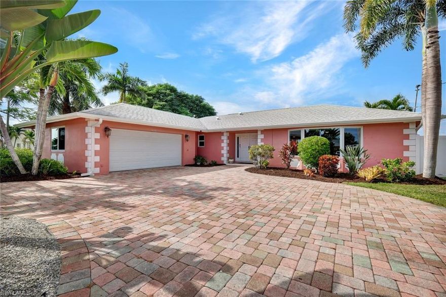 Discover the perfect blend of character and comfort in this beautifully updated 3-bedroom, 2-bath home on a Gulf-access canal. Inside you will be greeted by a spacious Great Room bathed in natural light with a new hurricane-impact picture window (2024). The home’s retro 60s–70s vibe adds personality, while updates ensure modern convenience. The kitchen has sleek finishes and stainless-steel appliances (2023), and the guest bathroom underwent a full remodel in 2023. Durable tile flooring flows throughout, perfect for effortless Florida living. Relax or entertain on the expansive covered lanai overlooking an oversized pool, resurfaced with pebble tech. The fully fenced backyard features black aluminum chair-rail fencing along the canal and new PVC privacy fencing with gates. A great area for your dog and children to play. Recent Upgrades include • New HVAC system (2025) and ductwork (2014) • Impact-resistant windows throughout (2024) • Stainless steel kitchen appliances, washer & dryer (2023) • Complete plumbing re-pipe (2014) • New roof installation (2018) A bonus is the convenience of having an Electric Level 2 Car Charger for your EV or hybrid, a brick paver circular driveway, a side-load garage, and the tranquility of a corner lot on a quiet dead-end street.
