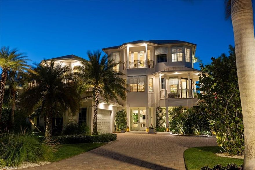 Experience the essence of luxury bayfront living in the idyllic double-gated enclave of Southport on the Bay at Barefoot Beach in Collier County with this fully reimagined and meticulously renovated residence, offering convenient beach access and captivating bay views from every room. Enjoy the beauty of sunrises and sunsets from the open-concept living area, enhanced by exceptional high-end finishes and spacious screened outdoor balcony. The chef’s kitchen features high-gloss German cabinetry and top-tier appliances by Sub-Zero, Miele, Wolf, and Fisher & Paykel, with Dornbracht and Brizio faucets, all showcasing a dramatic backlit Cristallo waterfall island. Soaring ceilings, white oak hardwood floors, custom millwork, glass railings, fine window and wall treatments, and curated lighting fixtures create a warm yet refined ambiance. The upper level is entirely dedicated to a 1,300-square-foot primary suite with a spa-style bath featuring exotic stone, Dornbracht and Graff plumbing fixtures, Kohler Numi smart commode, custom Italian closet systems, sitting area, office/den, newly installed skylights and private laundry room, offering magnificent views in all directions. Outdoor living is equally elevated, with covered lanai, heated saltwater pool and spa, linear fireplace, motorized pergola, extensive natural stone flooring, and maintenance-free decking on the upgraded boat dock with 10,000-pound lift. Lush, professionally lit landscaping enhances privacy, while peace of mind is helped via 24/7 guard-gated security, a 38-kilowatt Kohler whole-house generator, impact-rated windows and doors, commercial-grade fire sprinklers, elevator, top-of-the-line Trane HVAC systems and pool heater installed within the last two years, and mosquito misting system. No water intrusion during the 2024 storms, according to the owner. This exceptional home invites you to embrace the modern coastal lifestyle with direct access to the Gulf’s pleasures in 10 minutes by boat with no bridge, or a short distance down hand-laid brick streets lined with towering Royal Palms to the pristine beach