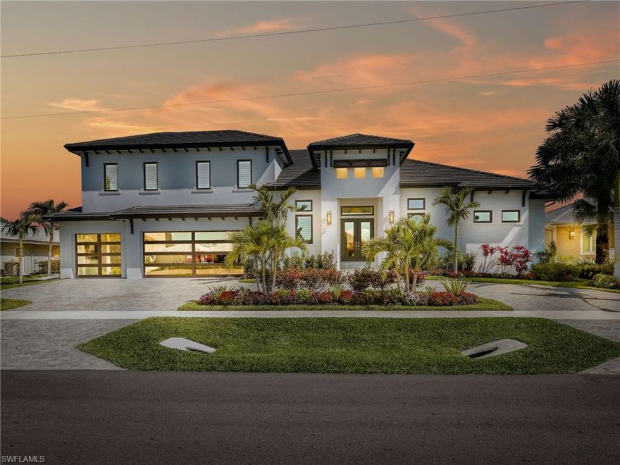 Experience the height of coastal luxury in this exquisite 2024 waterfront estate, ideally situated on Marco Island with coveted direct Gulf access. Designed to blend sophistication with effortless living, this remarkable home features 4 generously sized bedrooms, a versatile den/office, 4 full bathrooms, and a stylish powder room—all crafted with exceptional attention to detail and premium finishes.

Flooded with natural light from its sought-after southern exposure, the residence offers stunning water views and seamless indoor-outdoor living. The open-concept layout is highlighted by soaring ceilings, pocket glass sliders, and an elegant great room centered around a striking indoor gas fireplace—perfect for both intimate evenings and upscale entertaining.

The kitchen is a true showpiece, equipped with high-end appliances, custom cabinetry, and an oversized island that flows beautifully into the living and dining spaces, with a natural gas stove for elevated culinary performance.

Step outside to your private waterfront retreat, featuring a new seawall and a picture frame pool screen that provides unobstructed views. The covered lanai, outdoor kitchen, outdoor gas fireplace, and generous lounge areas create an inviting setting for unforgettable sunsets and year-round enjoyment.

Upstairs, a spacious loft offers exceptional flexibility, complete with a stylish wet bar—ideal for a media room, home office, or additional living space.

Additional highlights include a 3-car garage featuring modern glass doors, impact-resistant windows and doors, and impeccable craftsmanship throughout. With direct Gulf access, boating enthusiasts will appreciate the unparalleled convenience and lifestyle this home provides.

This is refined waterfront living at its finest—where modern design meets timeless coastal elegance.