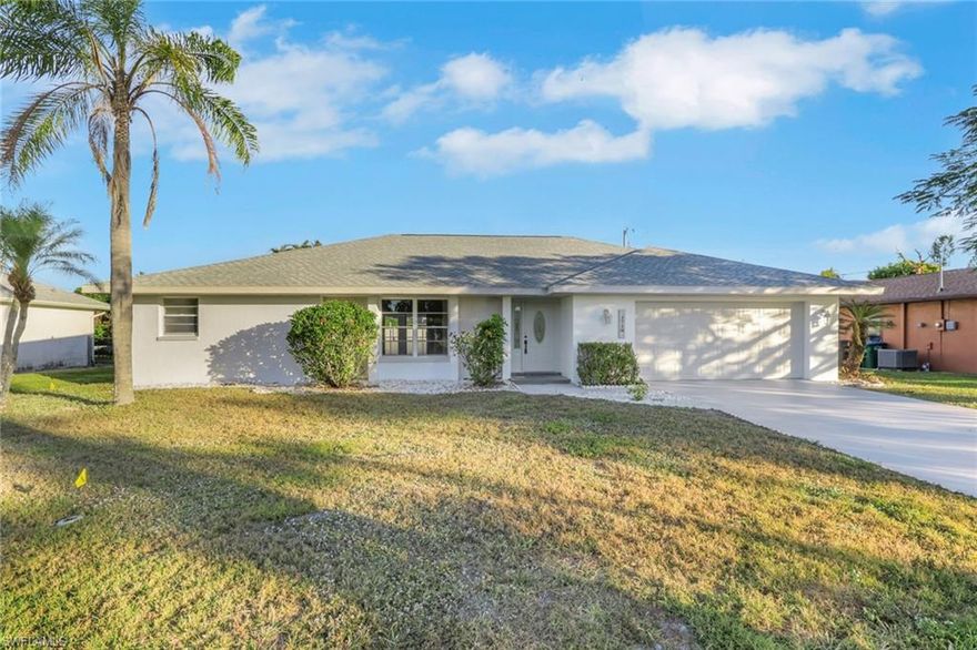 Discover your Florida lifestyle in this 3-bedroom, 2-bathroom pool home, nestled in the vibrant heart of Cape Coral. Just over 1,800 sqft, this home radiates charm with its lush landscaping and swaying palm trees! Step inside to an inviting layout featuring vaulted ceilings and an abundance of natural light that fills the space. Outside, your private oasis awaits. The expansive lanai overlooks a spacious pool, ideal for relaxing or hosting gatherings. The fenced backyard provides plenty of room for pets to play or for creating your own tropical retreat (irrigation system). Newer AC system, NEW water heater, newer roof, and freshly painted interior and exterior, this home is move-in ready and built for comfort. Pool was resurfaced in 2025 with decorative waterline tile! Oversized garage with insulated garage door panels. Perfectly situated for convenience, just minutes from popular shops and restaurants, including Walgreens, Publix, and Walmart. Enjoy quick access to Fort Myers via both bridges! Don’t miss this opportunity to own a slice of paradise! Call today to schedule your private showing! *Flood Zone X, No Flood Insurance Required, Never Flooded! All assessments paid in FULL!*