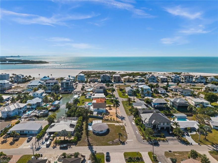Unique Coastal Retreat on Fort Myers Beach – Turnkey & Income-Producing! Welcome to this one-of-a-kind, charming 2-bedroom, 2-bath circular home tucked away on a private and quiet street in the heart of Fort Myers Beach. Thoughtfully designed and full of character, this home offers a warm, inviting interior and can be sold fully furnished and turnkey, making it truly ready to enjoy or rent immediately.

Just a 5-minute walk to the beach, you’ll love the relaxed coastal lifestyle this location provides. The screened-in lanai is perfect for morning coffee or evening gatherings, featuring cozy seating and outdoor dining surrounded by peaceful surroundings. Bike to the beach or cruise along Estero Boulevard, taking full advantage of everything the island has to offer.

This property has been featured on HGTV and is currently operating as a successful AirBnB, offering excellent income potential. Investors can enjoy strong rental revenue while still having the flexibility to use the home personally. It’s also an ideal option for a snowbird seeking a second home that helps pay for itself.

Conveniently located near grocery stores, dining, entertainment, and local attractions, this distinctive home blends privacy, charm, and unbeatable proximity to the beach. A rare opportunity to own a truly special property on Fort Myers Beach.