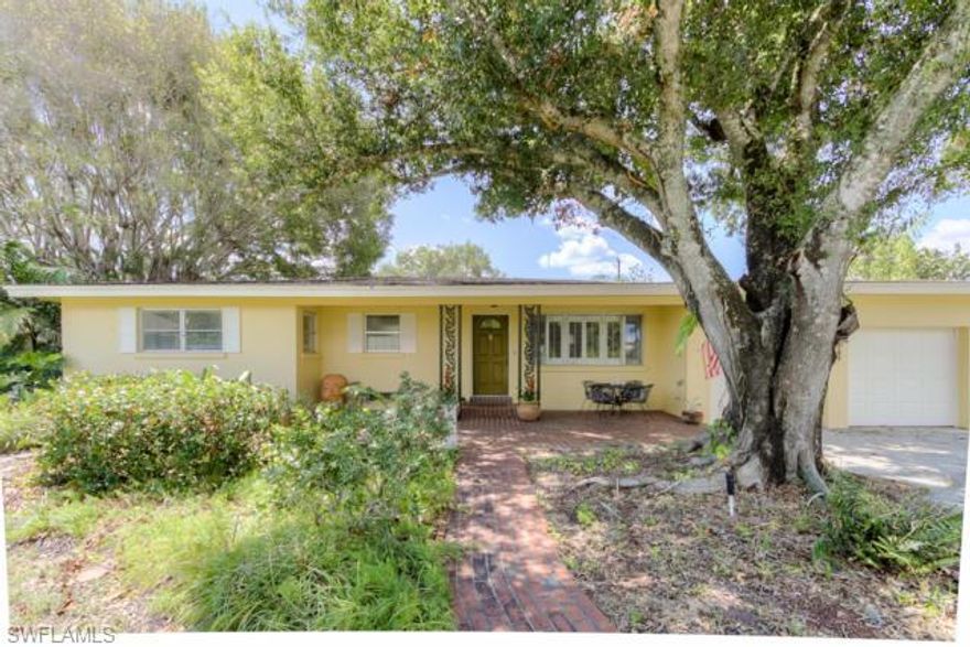 Under a large Oak tree is a beautiful 3BD, 2BA w/2 car garage and a perfect location, large lot 146x160 fenced. This charming home has custom tile, 42" cabinets in kitchen with stone counter top, Viking stone, sub-zero refrigerator & all appliances are stainless steel. Home has formal living & dining rooms w/an enclosed lanai for the perfect reading room and you will love spending time on the large covered porch with a view of the extra-large back yard. Plenty of room for a pool. A wonderful neighborhood to call home.