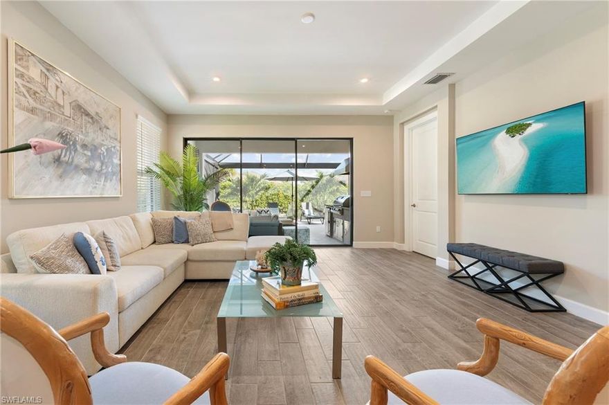 Welcome to resort-style living in this beautifully appointed Ceretti model twin-villa located in the highly sought-after Esplanade by the Islands. Designed for effortless Florida living, this home offers a bright, open-concept floor plan with elegant finishes and seamless indoor-outdoor flow. 3 Bedrooms plus a den at nearly 2000sqft of living space. The spacious great room is ideal for entertaining, opening to a well-appointed kitchen featuring quartz countertops, stainless steel appliances, ample cabinetry, and a eat-in kitchen area plus formal dining area. The private owner’s suite serves as a peaceful retreat with dual vanities, a generous walk-in shower, and walk-in closet. Two additional guest bedrooms and versatile den provide flexibility for visitors or a home office. Step outside to your extended screened lanai, perfect for relaxing and entertaining while embracing the Florida lifestyle. New hot tub included and new built in BBQ grill. This low-maintenance twin-villa allows you to enjoy all that Esplanade has to offer, including a resort-style pool, spa, fitness center, tennis and pickleball courts, clubhouse, and vibrant social calendar. Esplanade is ideally located off US 41 in sunny Naples, placing you within close proximity of beautiful Marco Island and Gulf beaches. Downtown Naples is also just a short drive away, with upscale shopping, dining and cultural attractions. NATURAL GAS in the community. Life at Esplanade provides unique opportunities centered around signature amenities and wellness programs to invigorate the mind, body and spirit. As a resident of Esplanade by the Islands, you will have access to world-class amenities and resort-level service. Enjoy grand wine tastings, exclusive culinary experiences, exotic excursions, live concerts, spa & wellness events and so much more! Amenities include a Wellness Center and Day Spa (hair, nails, facials, massage), Bahama Bar & Grille, Dog-Park, Tennis, Pickleball, multiple Pools & Hot Tub, Fitness Center, Planned Culinary Arts Center and so much more! New Publix connected to development next door. Make this brand-new villa your home in this amazing resort in Americas #1 place to live, Naples, FL!