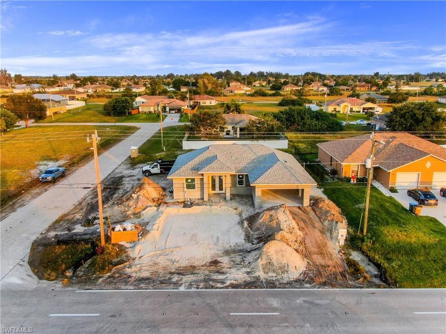 DON'T WAIT!! **Complete by March 2021** Welcome to NW of Cape Coral, one of the fastest growing areas in the beautiful city of Cape Coral !! This wonderful modern open concept, brand new Single Family Home "Santa Fe Model" sits  on a extended corner lot features nearly 1,550 Sq. Ft of living space, 3 large bedroom , 2 Full new bathrooms with Quartz, 2 car garage . Freshly painted inside and out, epoxy in garage, new kitchen with soft-close cabinets, Quartz counter tops, island, new stainless steel appliances, new 8 foot tall doors, new based boards,  new AC system, new light fixtures, new plumbing, new smoke detectors, alarm system new water heater, new well equipment. Home is equipped with Taex built-in pest control system, irrigation system, hurricane impact doors and windows, laundry room, Spacious master bedroom, new master bath, double-sink, 1 huge walk-in closet, new plank tile throughout the home. The location is close to many of Cape Coral top schools, closer to US 41, North Fort Myers, hospitals, shopping, dining, entertainment & less than 30 mins to SW Florida International Airport, NO HOA Fees. This home will not last! Renderings photos and city water!