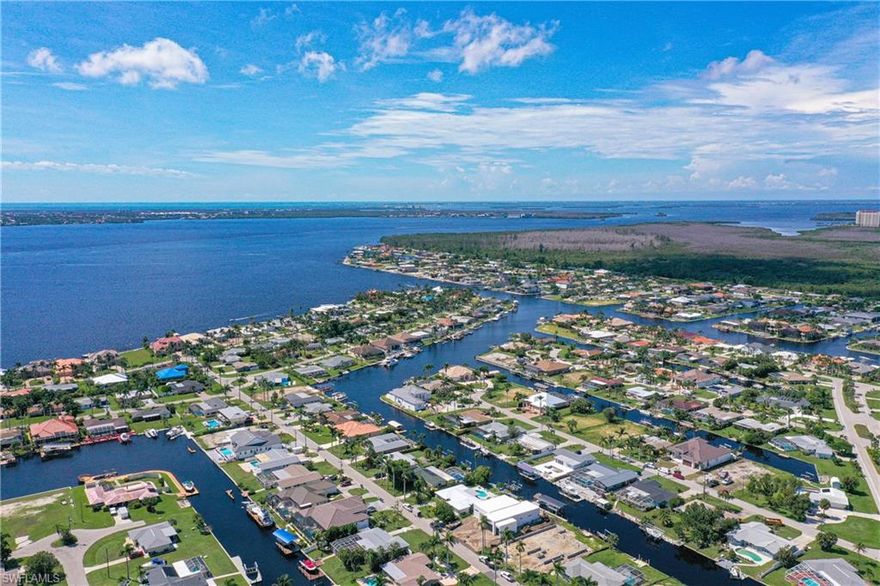 Fabulous gulf-access lot on intersecting canals. Extra wide view and Western rear exposure. Cleared and ready for your new build.  Surrounded by multi-million dollar homes in a prestigious Yacht Club neighborhood. Fabulous sunsets looking down the 200 ft wide Bay Shore Canal. Literally 1 minute boat ride to the Gulf’s open water.  No bridges or locks.  Seller would consider financing on a first mortgage with 50% cash downpayment.