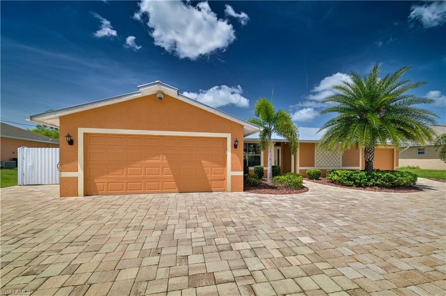Take a look at this GORGEOUS 3 bedroom 3 car garage Pool/Spa home located centrally in the SW Cape Coral area.  This home features tile throughout the main areas with wood/laminate in the bedrooms.  Kitchen features exotic granite, additional built in cabinets for extra storage and stainless steel appliances.  The outdoor pool area is INCREDIBLE.... Heated Spa, Built in Bar, and tropical landscape will make this the place you want to spend most your days.  Some other BONUSES include a fully fenced in yard (2019),, Newer Roof (2016) Newer A/C System, and the addition of the 3rd Car Garage and massive brick paver circular driveway! Add this one to the list for a personal showing or request a VIRTUAL showing today.