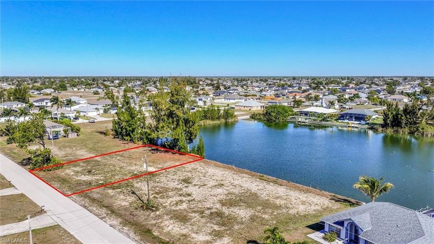 Waterfront homesite with lake views in NW Cape Coral. This beautiful freshwater lot features 85 feet of water frontage on scenic Lake Asa with Eastern exposure, offering peaceful sunrise views and warm morning light. Ideal for boating, kayaking, or fishing, the property provides direct access to Cape Coral’s extensive freshwater canal system. Located in a quiet area but just minutes from Pine Island Road, it offers convenient access to shopping, dining, schools, and area beaches. This oversized lot offers a balance of privacy and connectivity, making it suitable for full-time residence, seasonal living, or investment. With space to build a custom home and outdoor living area, and no HOA restrictions, it’s a standout opportunity in one of Cape Coral’s fastest-growing areas.