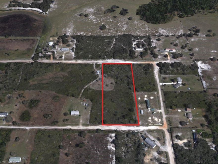 Great lot for a home, RV, or investment property. Lot is high and dry and NOT in a flood zone. Near the entrance and paved road. Better road quality than other lots in the neighborhood.