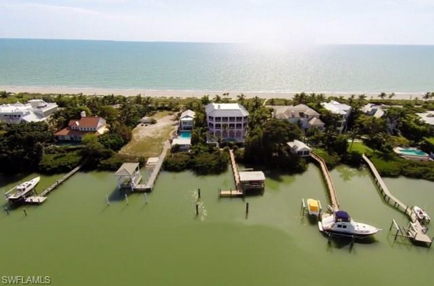 PRICE REDUCED!!!! SELLER WANTS IT SOLD! Priced below reproduction. Island Style Architecture that provides a relaxed balance between indoor & outdoor living. This luxurious 6 Bedroom Gulf to Bay Beach House features an open design, that captures breathtaking vistas from every room. All the amenities & quality expected, relax & enjoy spacious multi level front and back lanais for everyone to enjoy, a warm & inviting study, live-in guest quarters, elevator, pool & spa area, lush tropical grounds & the best multi space deep water dock at the mouth of the Bay. Have fun, relax, rejuvenate, be pampered. It is all realized here.