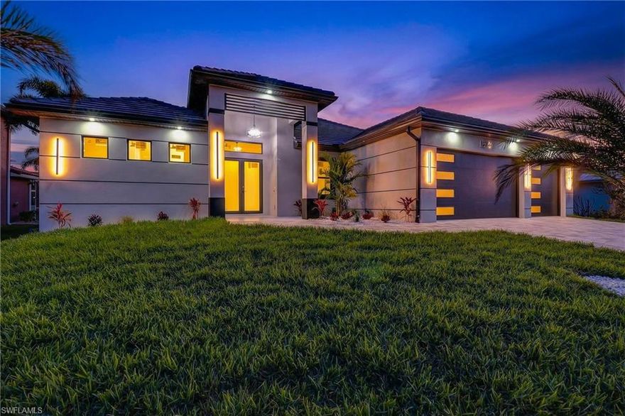 Southern Exposure Luxurious New Pool Home Nestled in the highly sought-after and tranquil residential  neighborhood South of Cape Coral Parkway Built across from Gulf access homes in Unit 69 .Cape Coral’s exclusive SW corridor of Luxurious Estate homes. This luxurious single-story masterpiece with Southern Exposure offers the perfect blend of elegance, comfort, and modern sophistication. From the moment you arrive, you’ll be captivated by the home’s clean architectural lines, expansive driveway, and impeccable curb appeal. Step inside to soaring ceilings, premium finishes, and a light-filled open-concept design that seamlessly blends indoor and outdoor living. This magnificent residence features a thoughtfully designed 3-bedroom + Den/office, 3-bathroom layout that caters to both relaxed living and stylish entertaining. The chef-inspired kitchen boasts custom cabinetry, walk in Pantry ,quartz waterfall edge custom center island and quartz countertops with stainless steel appliances includes separate cooktop and built in oven and Microwave combo all flowing effortlessly into the main living space. Designer large Porcelain tile flooring runs throughout the home adding to the upscale luxurious feel. Enjoy appointments in the living and dining area. The primary suite offers a serene retreat with dual vanities, a walk-in shower and separate soaking tub within, spacious custom built walk-in closets. Two additional bedrooms provide plenty of space for family or guests. For added safety and energy efficiency, the home is equipped with Low E impact-resistant full storm protection windows and doors, offering year-round peace of mind. Step outside to the covered lanai featuring a fully equipped outdoor kitchen, complete with a built-in gas grill, drink cooler fridge and sink—ideal for effortless outdoor cooking and entertaining. Adjacent to the pool area, a convenient pool bathroom offers easy access and added comfort for swimmers and guests. The beautifully landscaped backyard also showcases a custom-designed saltwater pool heated pool and European style spa that disappears within pool creating a private oasis fully screened for relaxation and outdoor enjoyment. Located just minutes from Cape Harbour, waterfront dining, boutique shopping and some of Southwest Florida’s finest beaches. This Newly constructed luxurious home delivers an exceptional living experience in one of Cape Coral’s most prestigious neighborhoods.